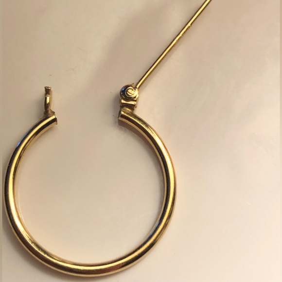 Gold hollow hoop Earrings with snap bar. - Picture 8 of 9